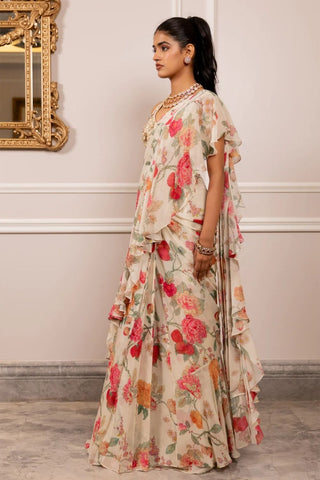 Side view of ruffled georgette saree showcasing soft floral print and fluid layered drape.