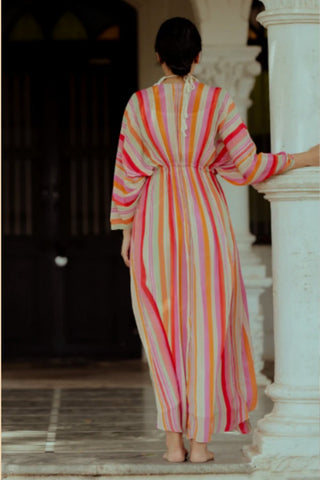 Back look of the striped kaftan highlighting vibrant patterns and graceful flowing silhouette.
