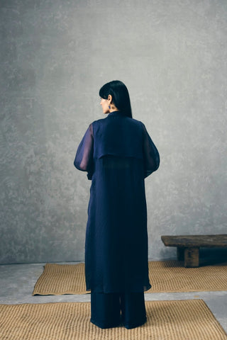 Nami three-piece navy blue jacket set showcases delicate organza embroidery, elegant layering, and refined tailoring, making it perfect for cocktail evenings and luxury events.
