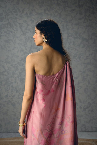 Back look of Penelope pink dress highlighting its distinctive one-shoulder chain detail and relaxed fit, offering a refined statement outfit for glamorous parties and soirées.