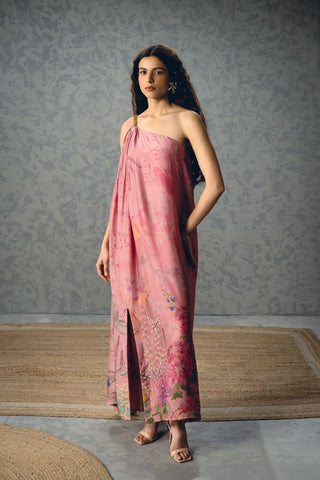 Penelope pink evening dress combines a graceful flowing shape with a one-shoulder chain detail and side slit, offering sophisticated designer style for glamorous occasions and celebrations.