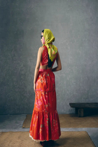 Back look of Selora warm-toned floral maxi with a fitted bodice and waist, creating a graceful feminine silhouette for daytime events and summer gatherings.