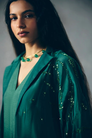 Close view of the Wasabi green jumpsuit set highlighting intricate embroidery on the elegant silk-organza jacket, adding refined detail to this sophisticated women's designer ensemble.