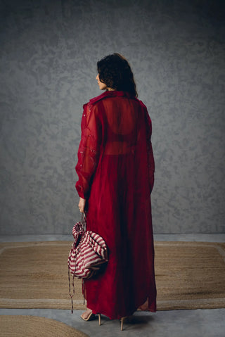 Back look of Nami outfit highlighting its sheer organza jacket layered over a fitted modal silk bustier, creating an elegant contemporary evening look.