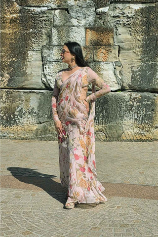 Elegant pre-draped saree in sheer chiffon fabric, elevated by a chintz embroidered blouse with zari and aari embellishments. Perfect for festive occasions, wedding, Events, Diwali party. Designed by Paulmi and Harsh.