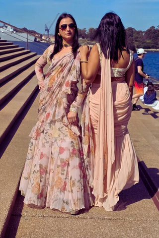 Elegant pre-draped saree in sheer chiffon fabric, elevated by a chintz embroidered blouse with zari and aari embellishments. Contemporary modern ethnic saree for festive gatherings, parties, weddings.