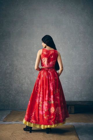 Back look of embroidered red skirt ensemble highlighting gathered silhouette and refined tailored finish.