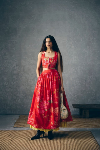 Designer red skirt set with embroidered waistcoat detailing and soft gathered silhouette for statement wear. Perfect for celebrations, festive gatherings, brunch occasions, and elevated occasion wear styling