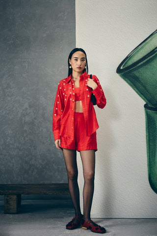 Trendy red checkered set featuring a bustier, embroidered shirt, and matching shorts. A fun yet refined outfit ideal for casual wear, brunch outings, or chic summer looks.