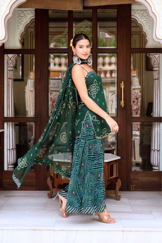 Traditional green bandhani kurta palazzo set made from georgette with soft cotton lining, paired with dupatta, perfect for casual and festive occasions.