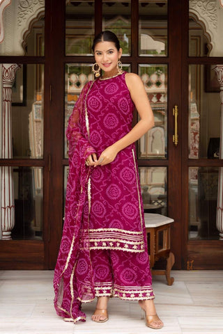 Women’s cranberry Bandhej suit set in soft georgette fabric with matching dupatta, fully stitched traditional outfit by Pomcha Jaipur ideal for festive occasions and ethnic celebrations. Designed by Pomcha.