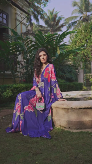 Model posing in Blue Floral Print Kaftan Set crafted in crepe fabric designed by Paulmi and Harsh. A perfect women indo-western outfit for evening outings,  beach wear, party, summer wear, dinner date, engagement parties, fancy brunch date, a dress to flaunt and contemporary style for any occasion.