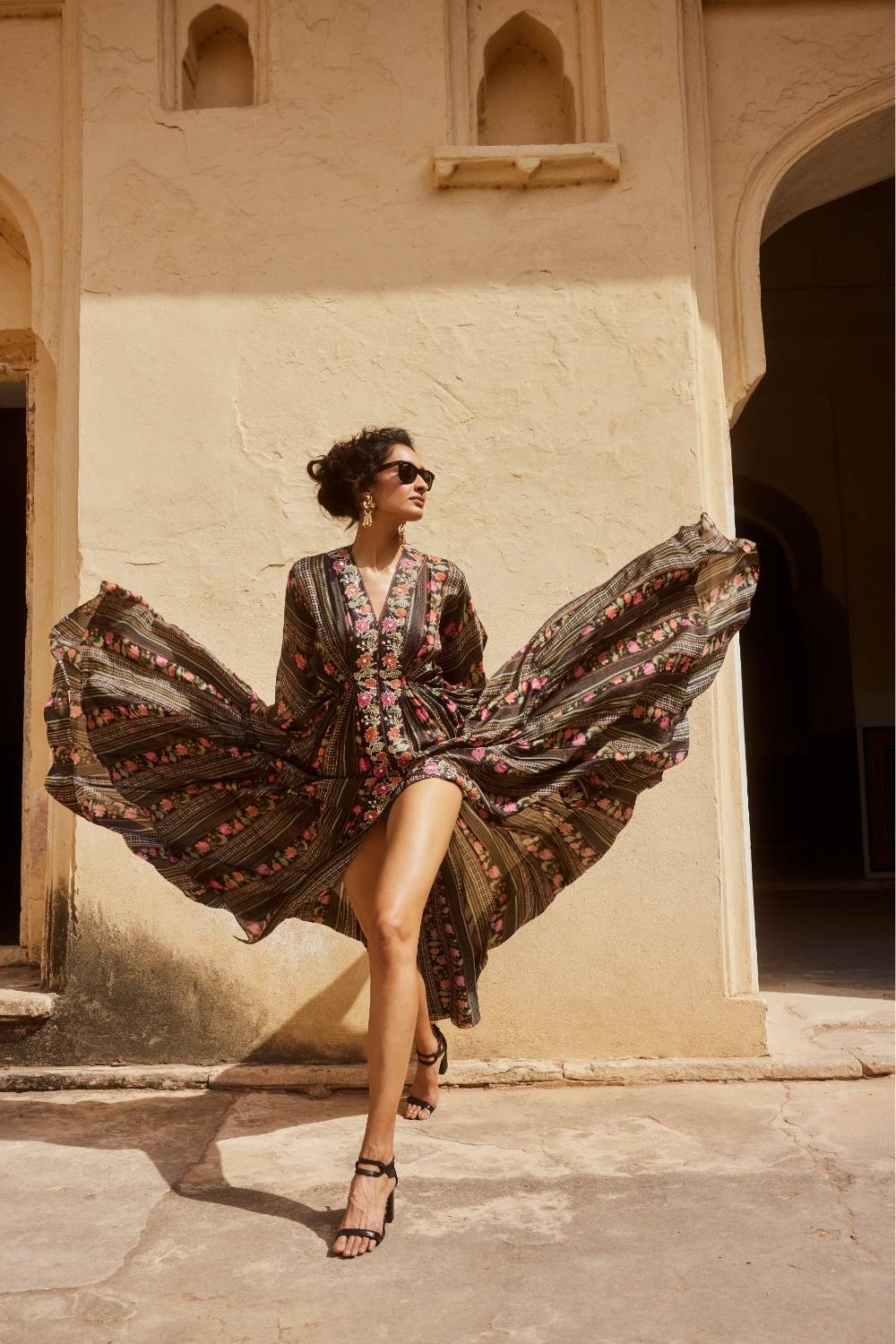 A vidoe of model posing in a luxury black Briar kaftan designed by Paulmi & Harsh, ideal for resort holidays, beach brunches, birthday celebrations, and chic clubwear by the sea.