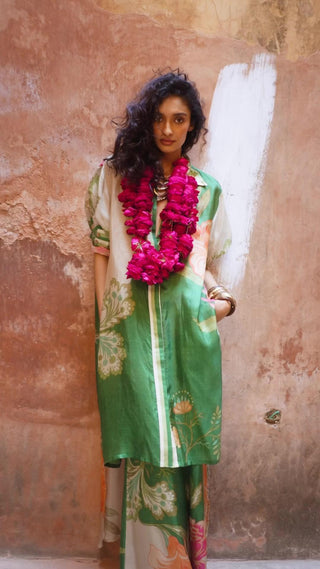 Model in chic high low kurta set, in a striking blend of colors and print for shooting reel. Elegance and comfort to your wardrobe. Perfect outfit for relaxed vacation, summer, evening gatherings, friends' hangout. Designed by Paulmi and Harsh.