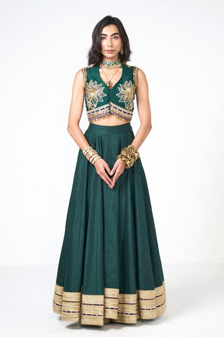 Luxury Jalsa Lehenga Set in bottle green Dupion fabric with exquisite hand embroidery and shimmering scattered sequins. Designed by Rishi and Vibhuti, this elegant skirt and blouse set is perfect for bridal festivities, wedding celebrations, and festive occasions.