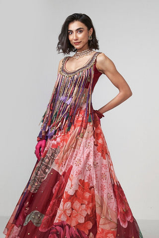 Luxury organza lehenga set with handcrafted embroidery and embellished trim work, paired with a matching blouse and flowing skirt for elegant celebration wear.