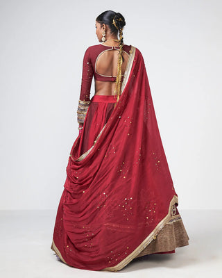 Back look of the Deewani Lehenga highlighting the fitted blouse and crystal-embellished detailing, a premium bridal ensemble by Rishi and Vibhuti.