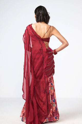 Back look of Elegant Cherry Dilkhush three-piece outfit featuring a cherry crepe skirt, embroidered blouse, and flowing organza drape. Hand embroidery and shimmering scattered sequins add timeless sophistication for weddings, parties, and festive events.