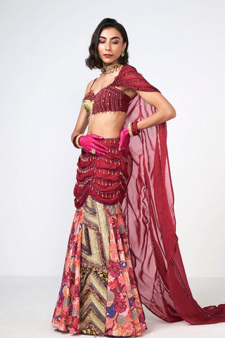 Designer Cherry Dilkhush skirt, blouse, and drape set crafted from premium crepe and organza in a vibrant cherry shade. Enhanced with handcrafted embroidery and delicate scattered sequins for a graceful festive and occasion wear look.