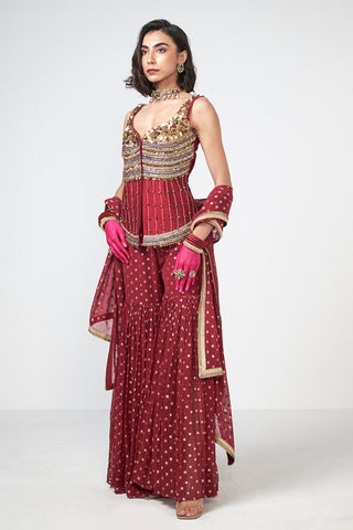 Elegant three-piece sharara set crafted in dupion and georgette with statement applique fringes, paired with matching pants and dupatta for festive occasions.