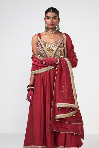 Designer cherry Anarkali set with refined hand embroidery and graceful traditional silhouette in luxurious Chanderi fabric.