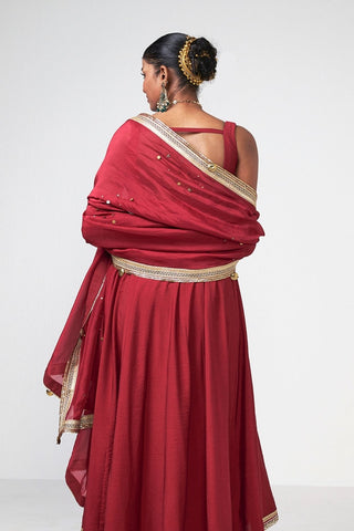 Back look of the cherry Anarkali ensemble highlighting the flowing silhouette and refined handcrafted detailing.