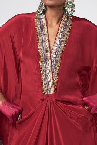Cherry crepe kaftan set featuring subtle hand embroidery, crystal hanging accents, and coordinated festive styling.