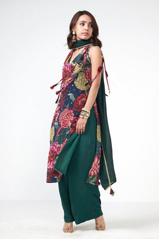 Elegant three-piece kurta set featuring handcrafted applique accents and graceful festive silhouette.