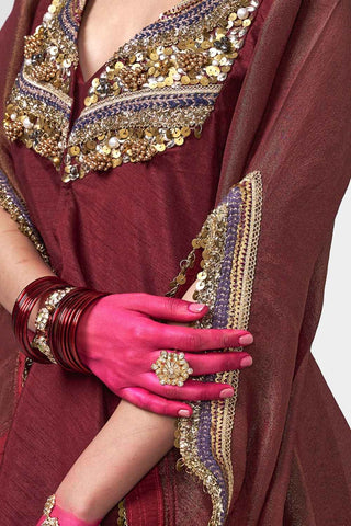 Modern Cola-colored kurta set with embellished jacket, matching pants, and tube top enhanced with applique work, sequins, coins, and tassel detailing for occasion wear.