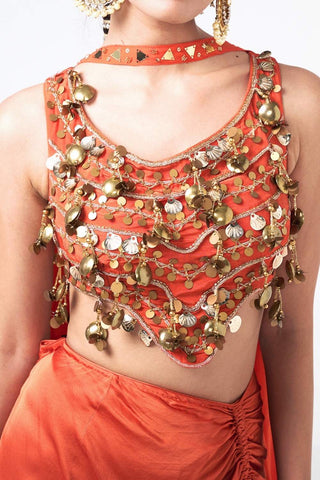 Close-up of bralet featuring golden ghungroo appliqué and hand embroidery, V-shaped waist detail for an edgy, high-end look.