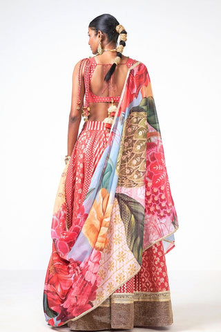 Back look of gulbahar Lehenga Set featuring coral Chanderi and organza fabric with beautiful appliqué work. The coordinated lehenga, blouse, and dupatta create a sophisticated ethnic outfit for weddings, receptions, festive occasions, and cultural celebrations.