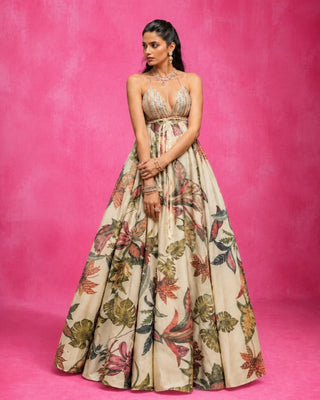 A skirt and blouse set built around restraint — ivory organza, finished with embellished trim along the edges that catches light without overwhelming the silhouette. Bagh Bahar translates loosely to "garden in bloom," and the piece carries that quietly, in texture rather than print.Effortlessly versatile for the bride-to-be — a standout choice for pre-wedding photoshoots, cocktail nights, and welcome parties, where its soft ivory tone and refined detailing photograph beautifuDesigned by Rishi and Vibhuti.