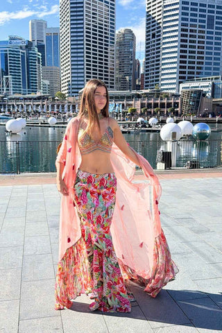 Contemporary multicolor lehenga set with detailed threadwork embroidery, embellished cape, and vibrant festive styling.