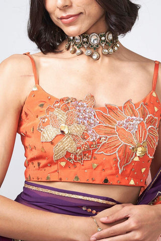Designer organza saree with coordinated crepe blouse showcasing intricate handwork and festive statement styling.
