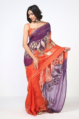 Luxury festive saree ensemble crafted with lightweight organza fabric and handcrafted detailing for special occasions.