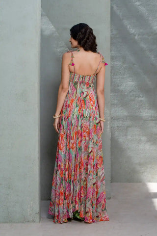 Model in Botanical Blossom by Rishi and Vibhuti combines a multicolor printed design showcasing the back look.