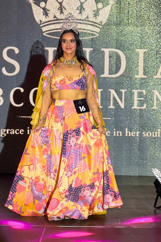 Raga Lehenga Set in buttercup yellow crepe and organza fabric featuring intricate lace detailing, embroidery, cutwork dupatta, blouse, and skirt. Statement women's wear for ethnic styling and festive occasions.