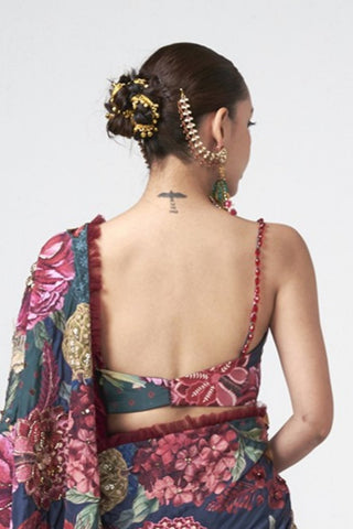 Back look of elegant cherry red printed saree crafted in soft crepe with subtle embellishments and refined embroidered detailing, perfect for cocktail evenings and celebrations.