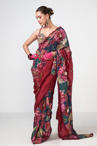 Glamorous printed saree with delicate golden bead embroidery and soft lace border, perfect for weddings, festive celebrations, and evening events.
