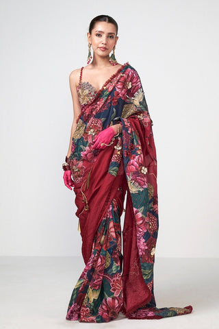 Statement floral saree crafted with refined hand embroidery and romantic tulle lace edging, blending timeless elegance with contemporary charm. Designed by Rishi and Vibhuti.
