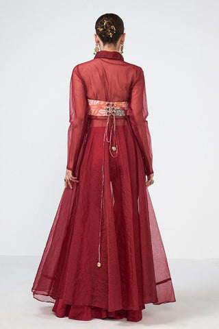 Back look of embroidered cherry cape ensemble highlighting graceful drape and contemporary festive styling.