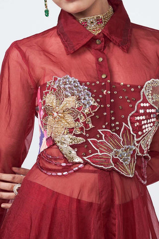 Detailed close-up of hand embroidery on luxurious organza, dupion, net, and crepe fabric textures.