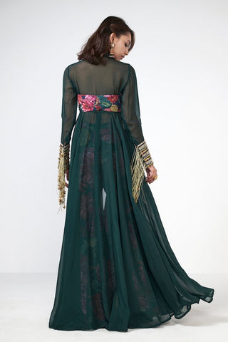 Back look of bottle green festive ensemble highlighting flowy jacket silhouette and refined embroidery accents.