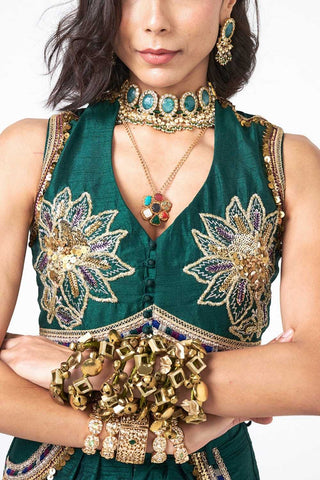 Designer bottle green Dupion crop jacket showcasing fine hand embroidery with scattered sequin detailing. The Dusk Doom Emerland ensemble combines luxurious craftsmanship and modern styling for festive occasions, parties, and celebrations.