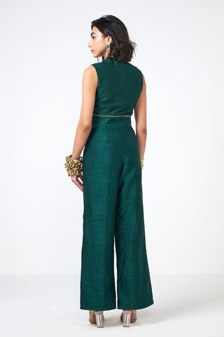 Back look Dusk Emerald two-piece Dupion coord set in bottle green featuring a stylish crop jacket and LL pants. Enhanced with hand embroidery and shimmering scattered sequins, this designer outfit offers contemporary festive elegance.