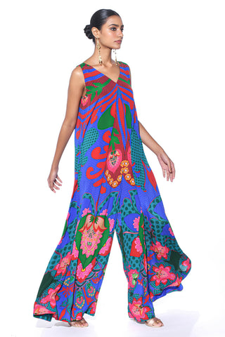 Model wearing Electric Blue Royal Paisley Inverted Box Pleat Wide-Leg Jumpsuit by designer Siddharth Bansal, featuring vibrant ethnic prints, structured pleats, and flowing wide-leg pants. Contemporary ethnic fashion.