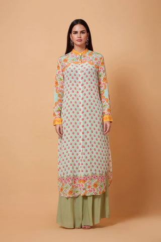 A grey and orange printed shirt dress featuring a structured mandarin collar and button-down front, styled with straight-fit green pants for a contemporary ethnic fusion look. Designed by Siddhartha Bansal.