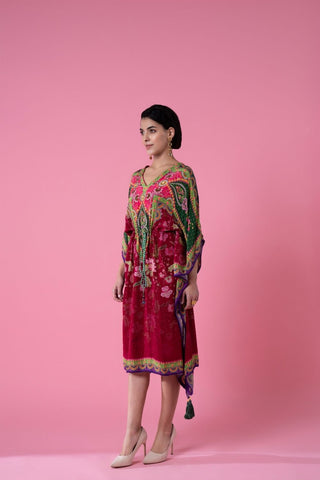 Breezy scarlet red and kale green printed, embroidered kaftan with pom-pom lace detailing, perfect for resort wear, featuring lightweight fabric, soft embroidery, and pom-pom lace trimming. The free-flowing design adds comfort and elegance for seaside evenings.