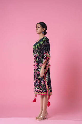 Black floral printed kaftan for women with neon pink and green patterns, V-neck design, loose sleeves, and a tasseled drawstring belt. Perfect for resort wear, casual day out, seaside evenings.
