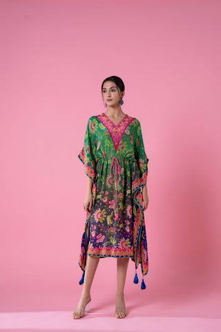 Tea Green And Yale Blue Ombre Floral Print, Embroidered Kaftan with Pom-Pom Lace Detailing. The kaftan drapes gracefully and offers a blend of comfort, style, and festive elegance suitable for evening wear, beach resorts, celebrations, and contemporary ethnic styling. Designed by Siddhartha Bansal.